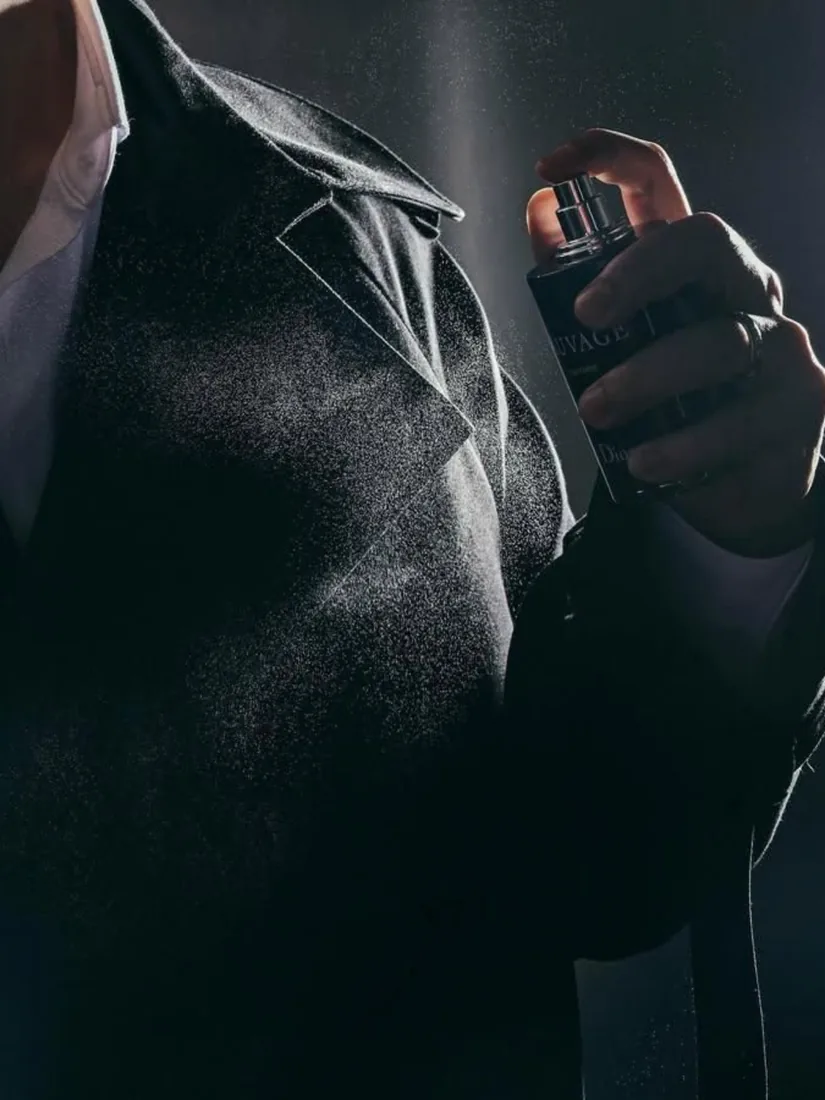 Man applying fragrance
