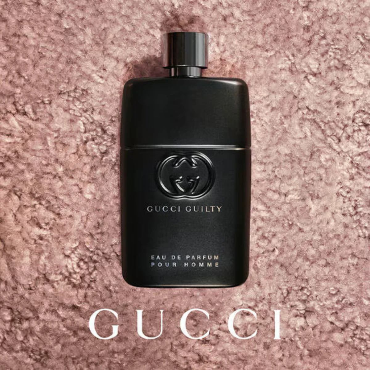 Guilty Pour Homme on a soft backdrop