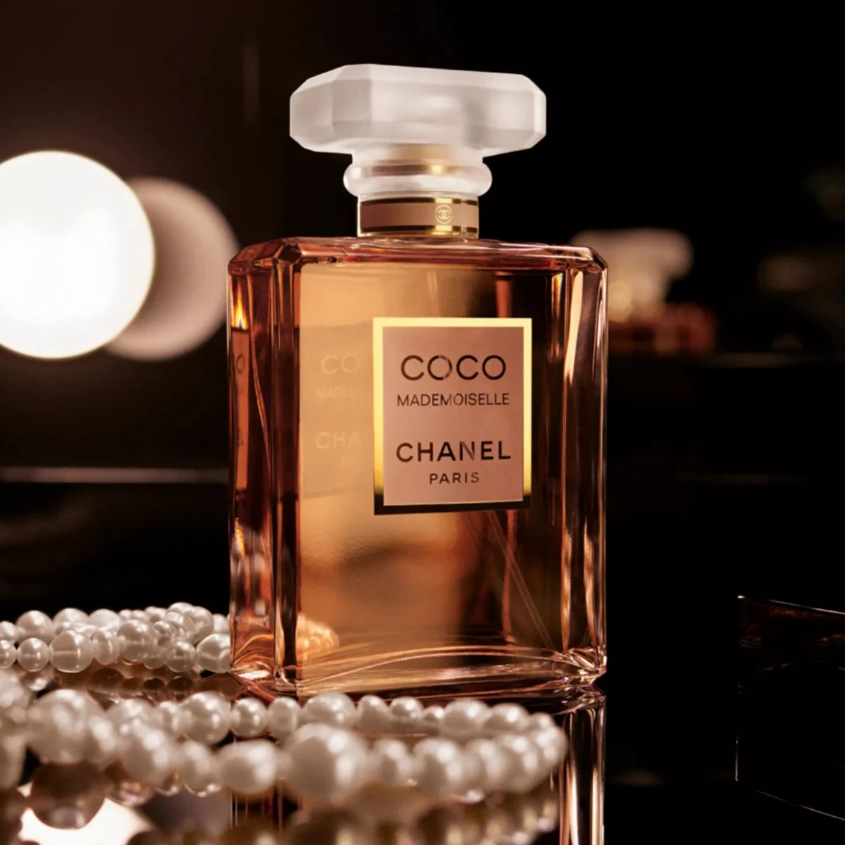 Coco Mademoiselle beside pearls
