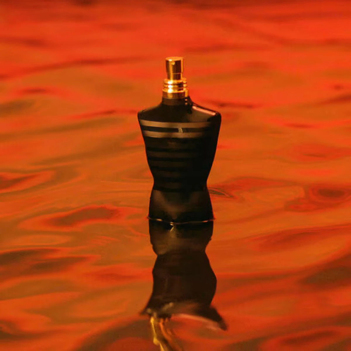 Le Male Le Parfum on a red backdrop